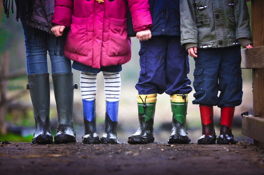 Four kids wearing wellies