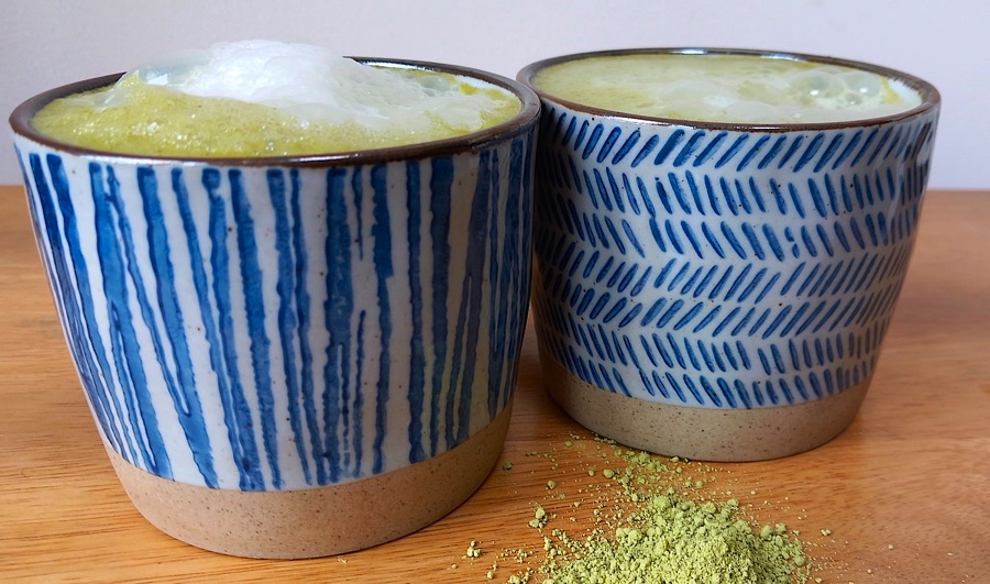 Matcha tea in blue and cream cups